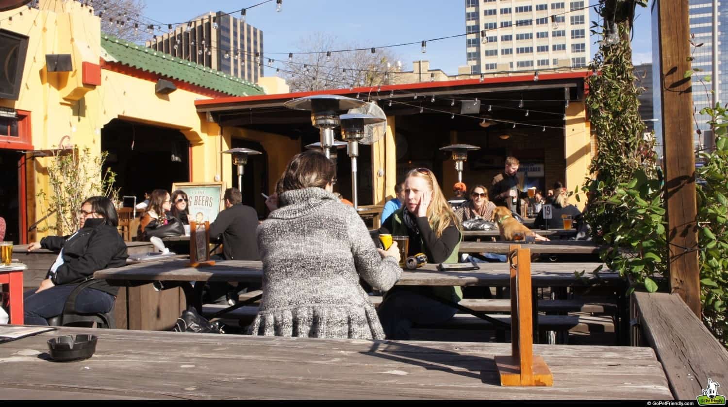 People sitting on a dog friendly patio in Warehouse District in Austin, TX