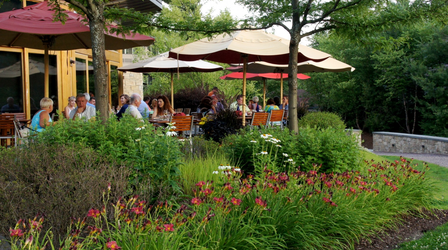 People dining on a pet friendly patio at Topnotch Resort and Spa - Stowe, VT