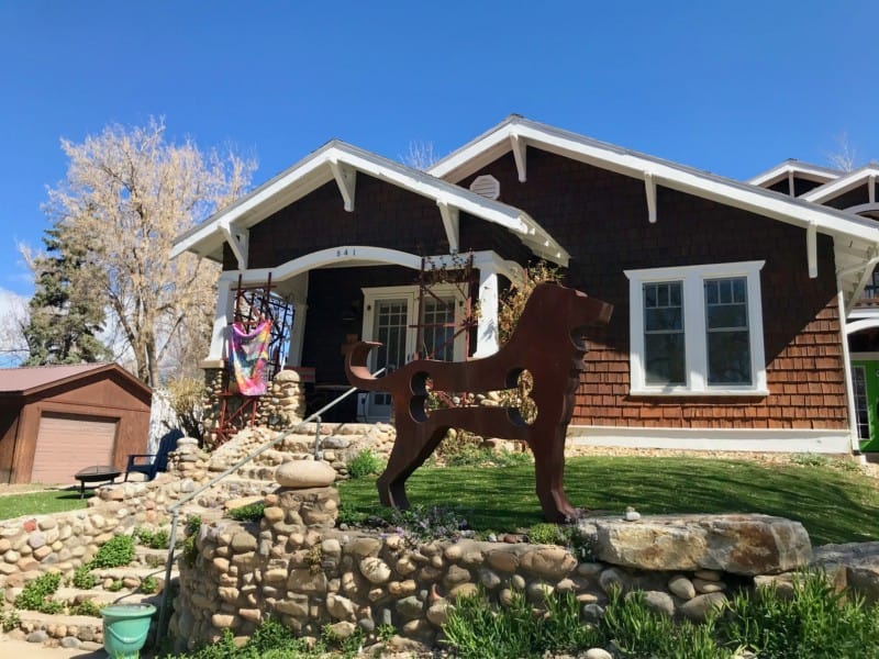 Dog sculpture in front of a home in Durango, CO