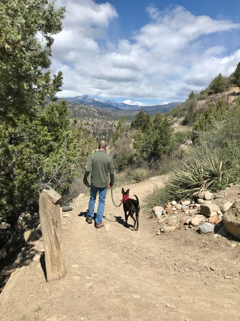 Man and dog on the dog friendly nature trail in Durango, CO