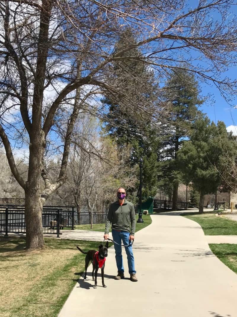 Man and dog on the Animas River Trail in downtown Durango, CO