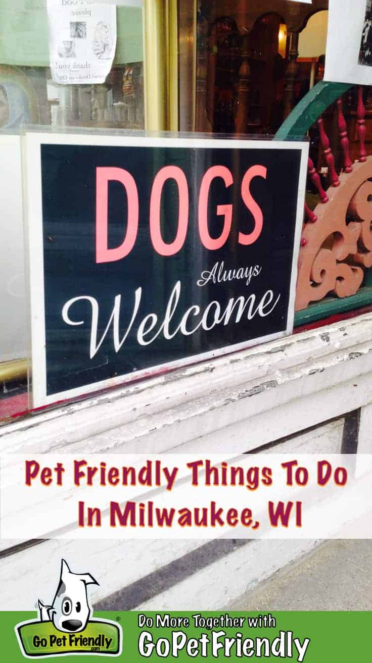 A "Dogs Always Welcome" sign in a store window in dog friendly Milwaukee, WI