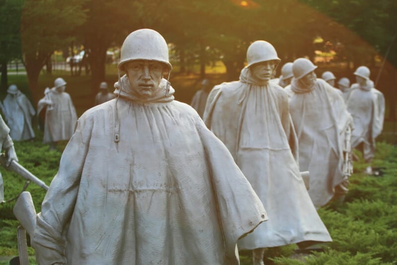 The Korean War Veterans Memorial statues located in National Mall in Washington DC with sunset light. 