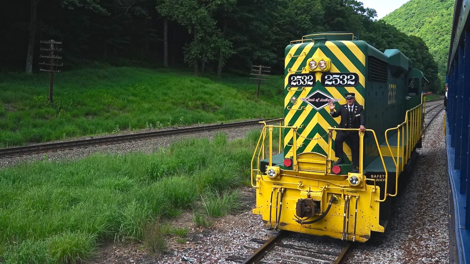 Engine passing the train cars on the pet friendly Lehigh Gorge Scenic Railway in Jim Thorpe, PA