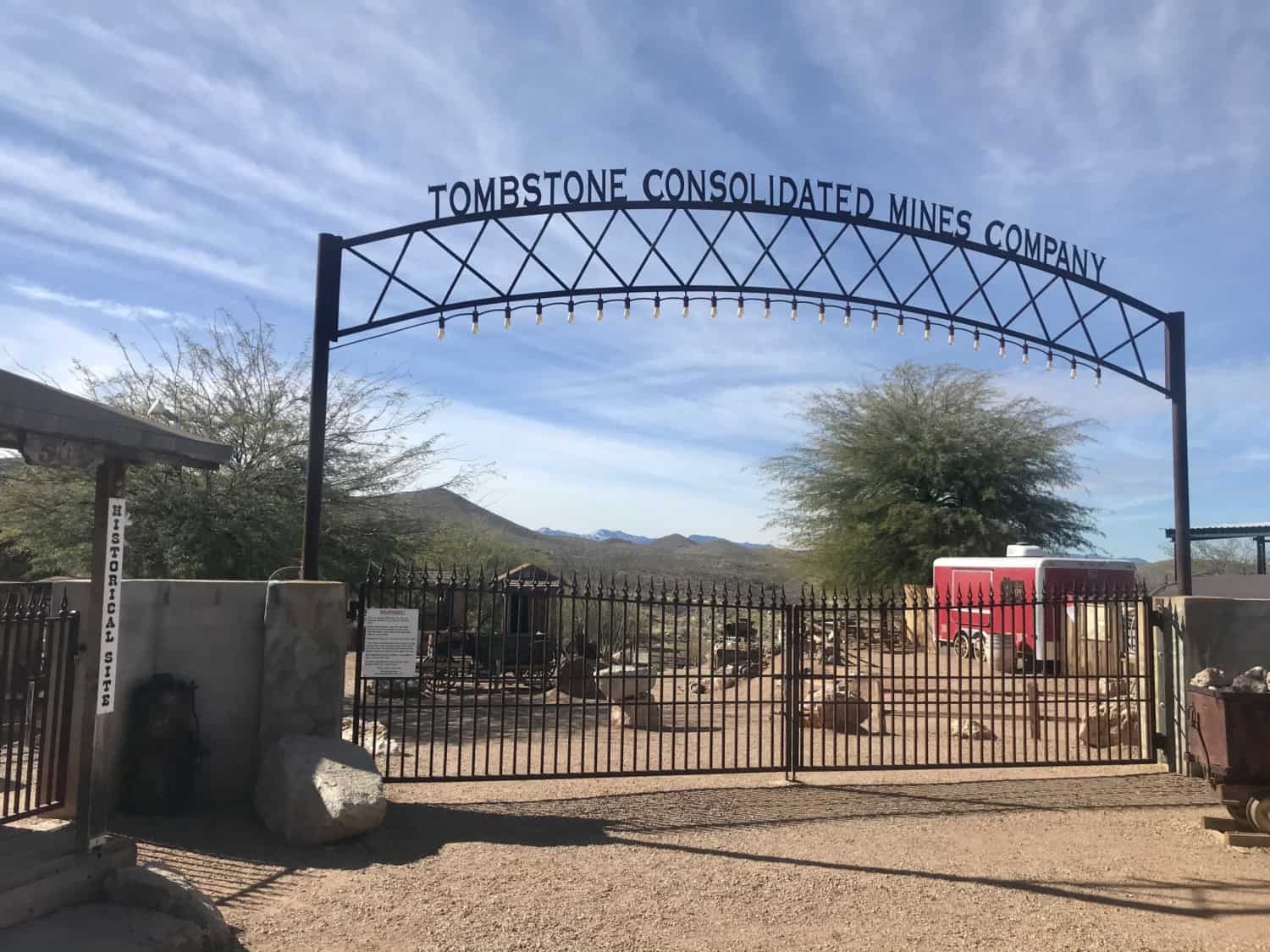 Metal lettering over a gate that reads Tombstone Consolidated Mines in Tombstone, AZ