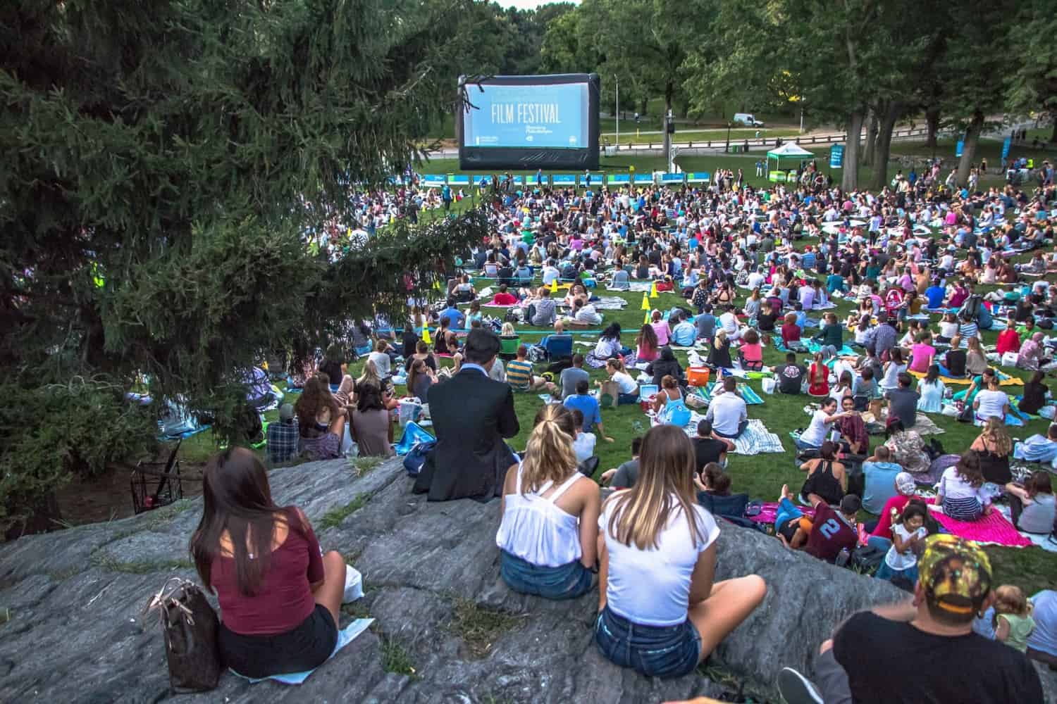 Crowd watching movies at the Central Park Conservancy Film Festival.