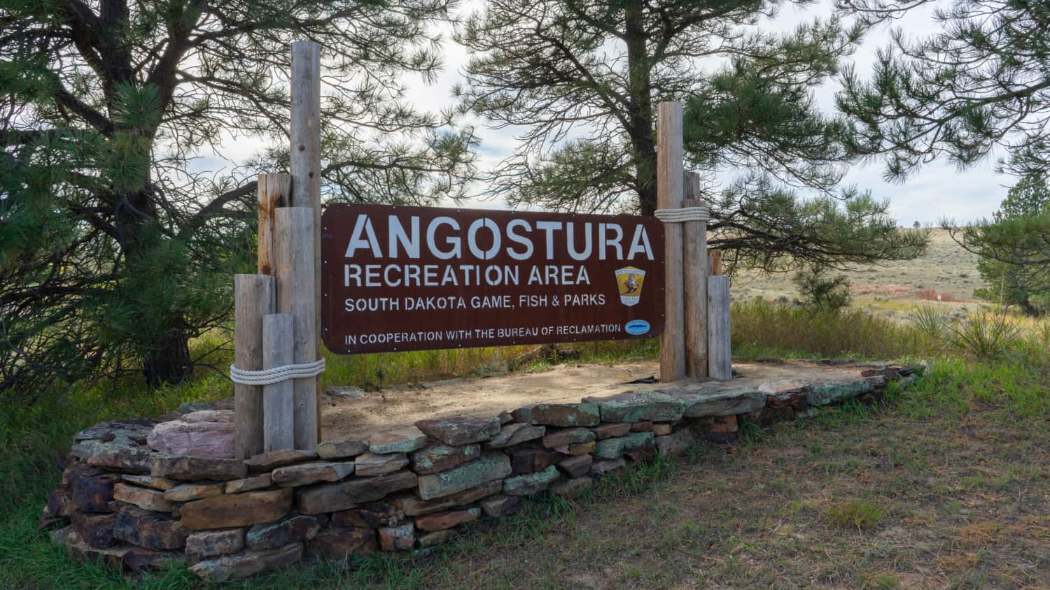 Entrance sign for pet-friendly Angostura Recreation Area in South Dakota's Black Hills