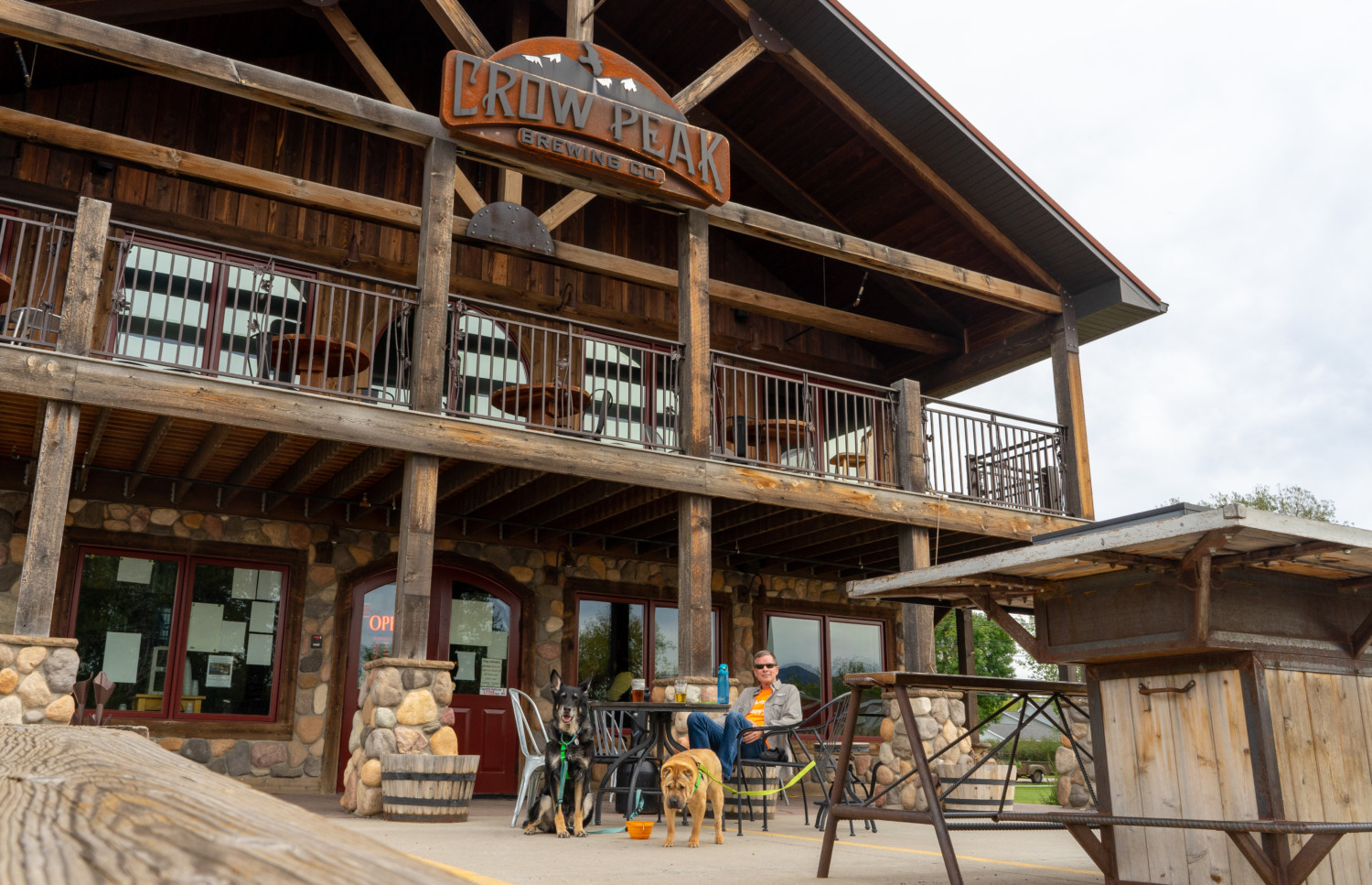 Rod, Buster, and Ty of GoPetFriendly.com on the pet friendly front patio at Crow Peak Brewing Company in Spearfish, SD