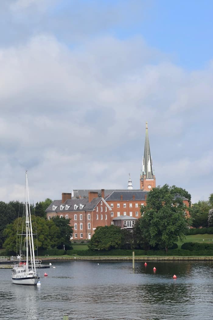 St. Mary's Church with sailboat on mooring field in foreground in Annapolis's Pet-Friendly Eastport Neighborhood