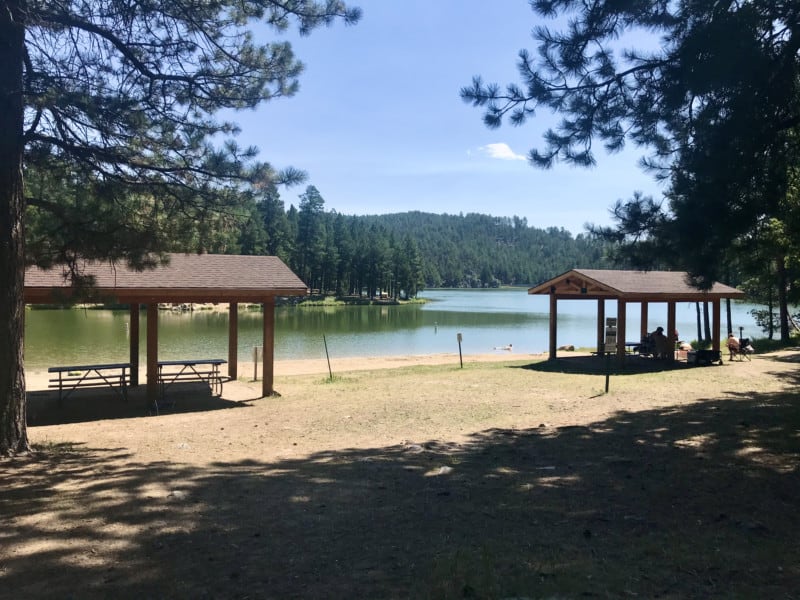 Pavilions, picnic tables and beach at Center Lake at Custer State Park, South Dakota