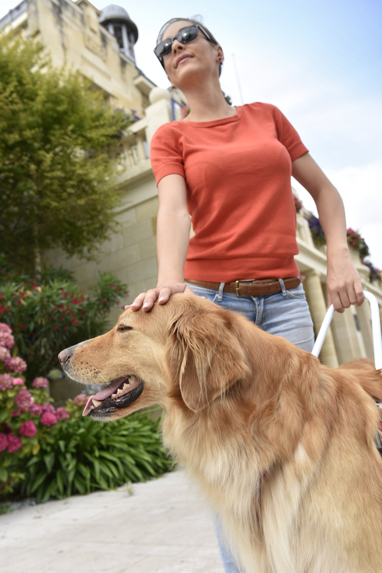 Blind woman and her Golden Retriever service dog