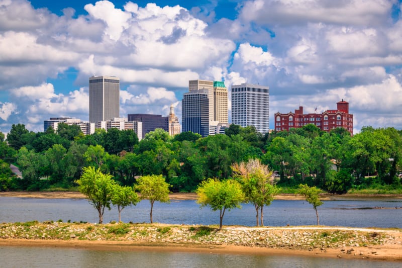 Tulsa, Oklahoma, USA downtown skyline on the Arkansas River at dusk.