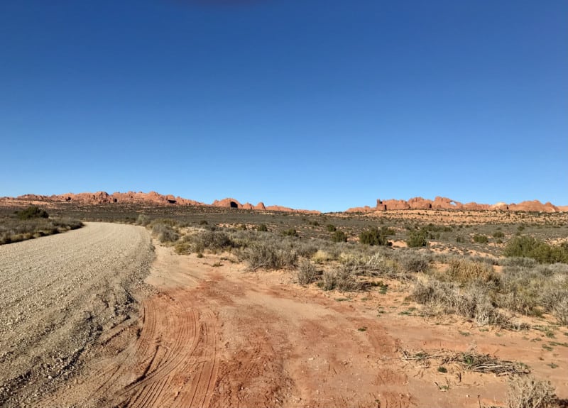 Arch in the distance from Salt Valley Road in Arches National Park - Moab, UT