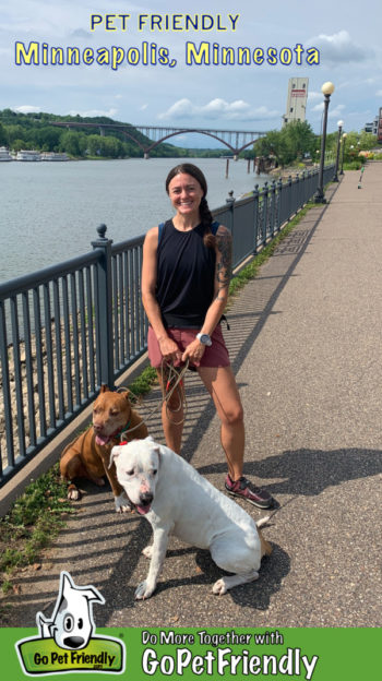 Woman with two dogs on a path in Minneapolis, MN