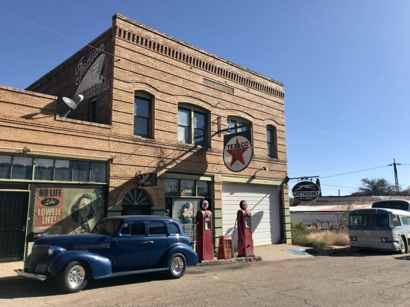 Antique car parked in front of a old Texico station in Lowell, AZ