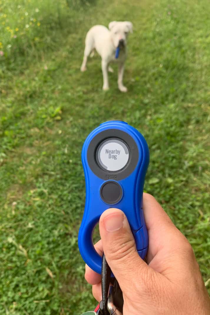 A hand-held tracking device showing the distance to the other tracker.