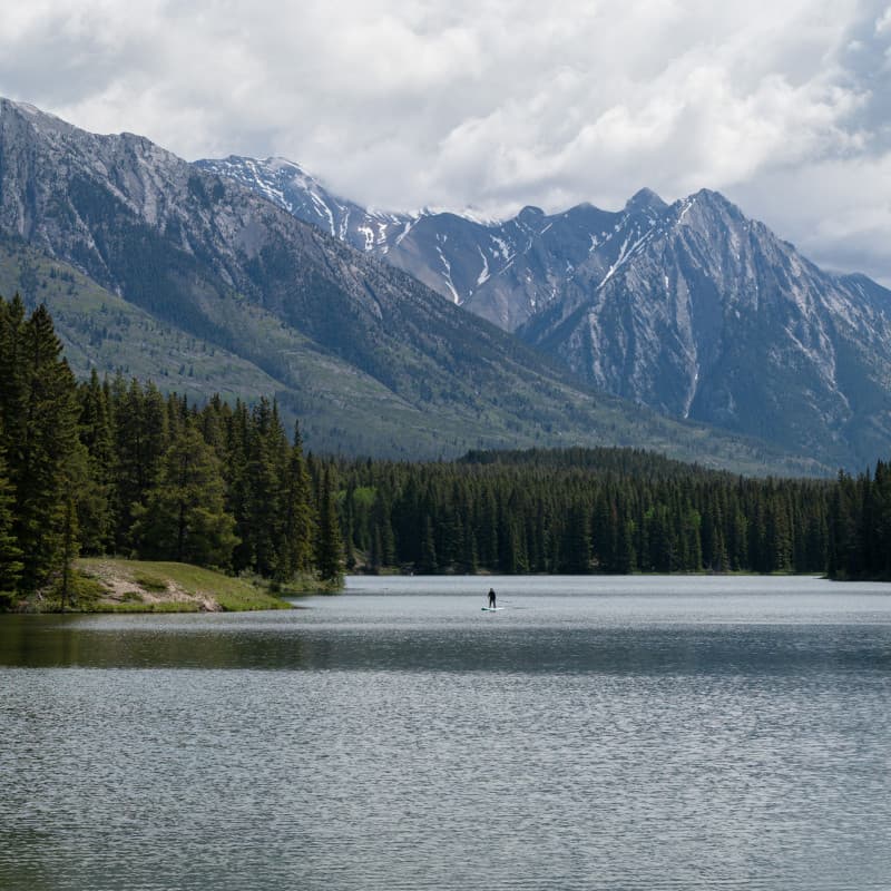 A paddle boarder on Johnson Lake, Banff.