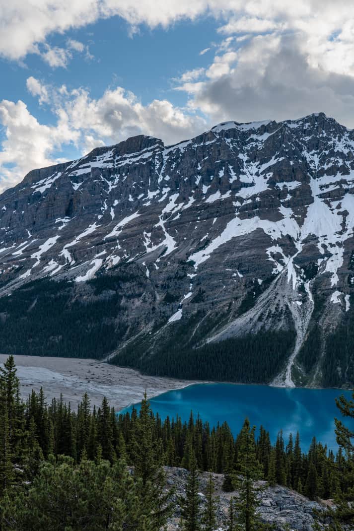 Bright blue water against the mountains in Banff.