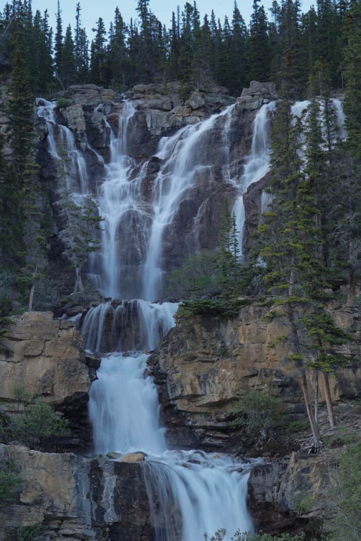 Slow shutter image of Tangle Falls in Jasper, a tall tiered waterfall.