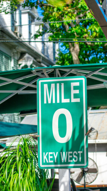 Famous Mile 0 street sign in pet friendly Key West, Florida.